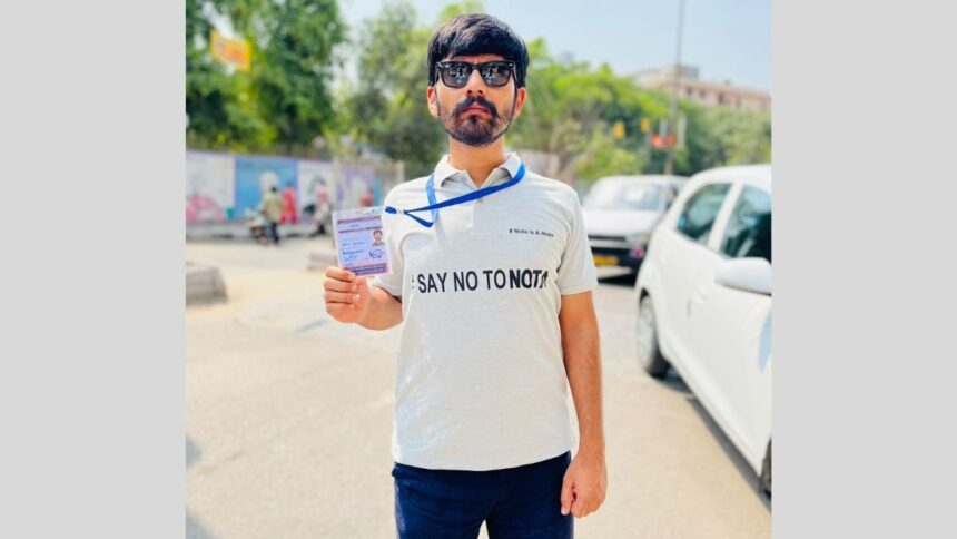 1-166 Championing democracy, Ravi Kiran Thilak Thatikonda garners attention with his unique voting initiative